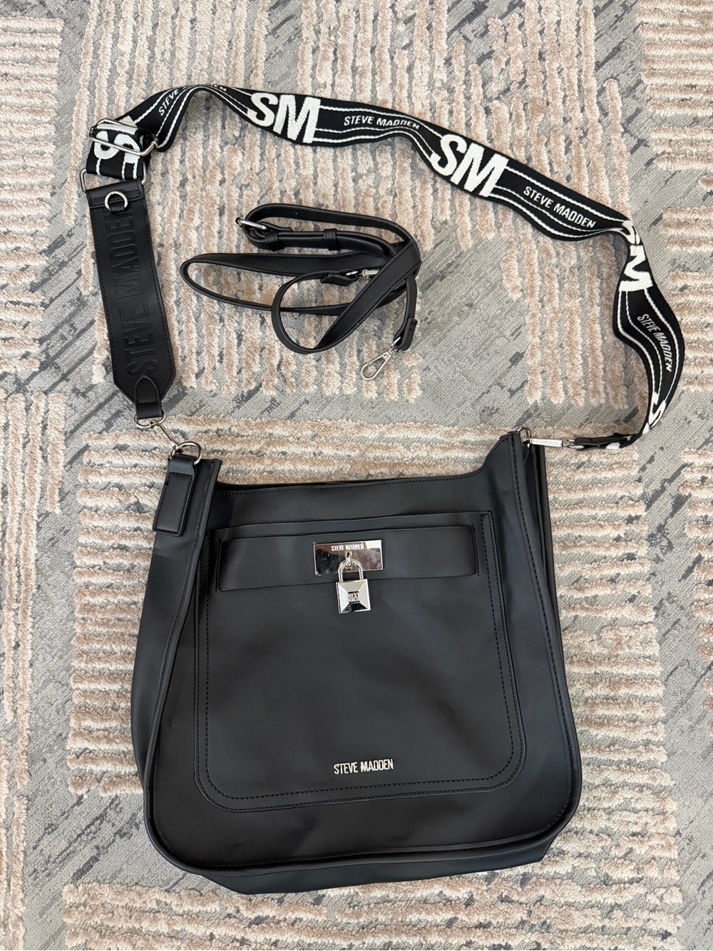 Steve Madden Black Crossbody Bag with Logo Webbing Strap and Silver Lock Accent